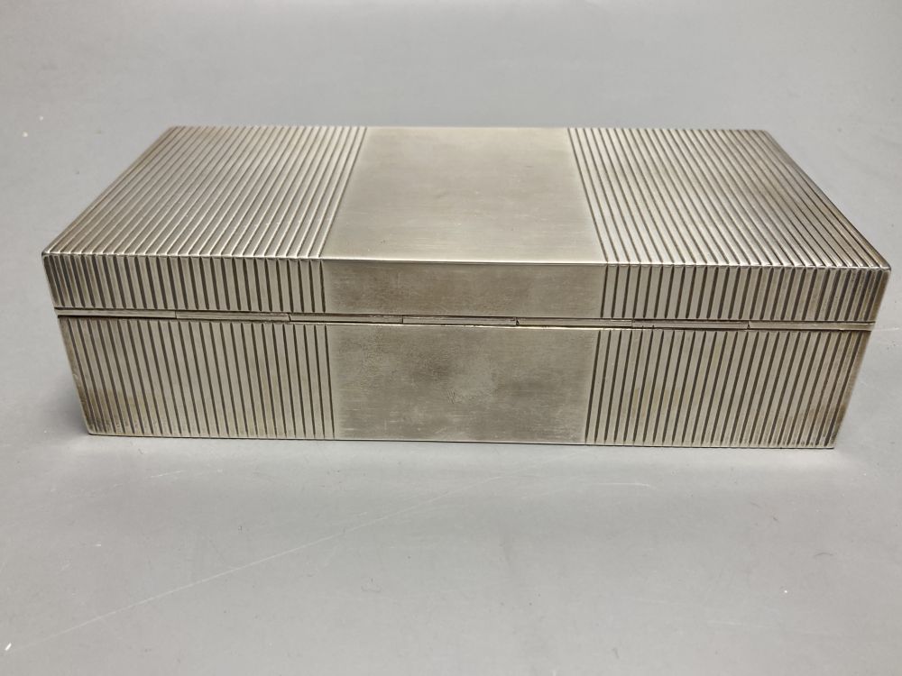 A George VI ribbed silver mounted rectangular cigarette box, Mappin & Webb, London, 1946, 17.8cm.